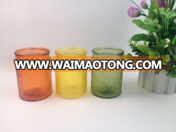 Unique glass candle jars wholesale and colored embossed glass jars for soy wax candle